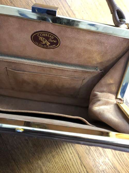 Genuine ostrich skin handbag in brown